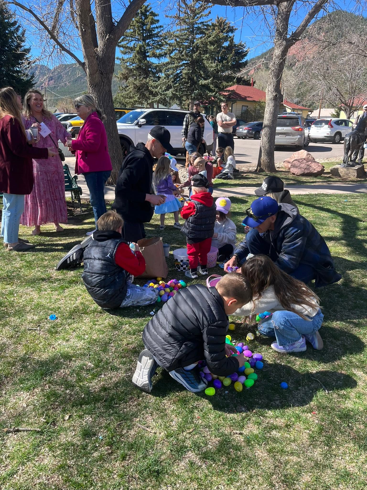 Kids sorting through their collected Easter eggs