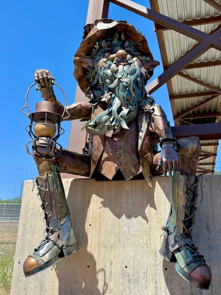 The finished Palmer Lake Troll sculpture on display