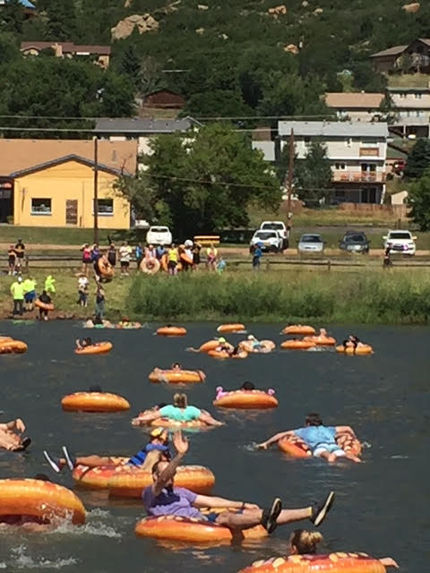 Tube swimmers making their way across Palmer Lake
